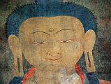 Lo Manthang Thubchen 04-4 Entrance Right Of Door Painting Of Buddha Close Up Buddhas eyes gaze down in me to the right of the assembly hall entrance door at Thubchen Gompa in Lo Manthang.
